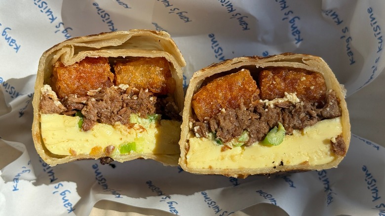 ﻿Cross section of Kang's Kuisine breakfast burrito in the box