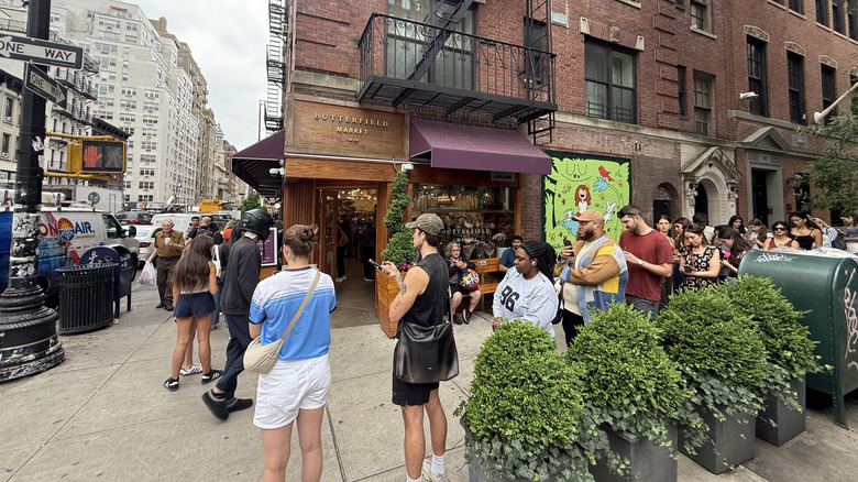 a line of people wait to buy their Dotcakes at Butterfield Market