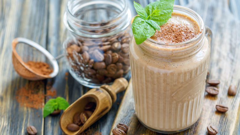 coffee smoothie with coffee beans and grounds