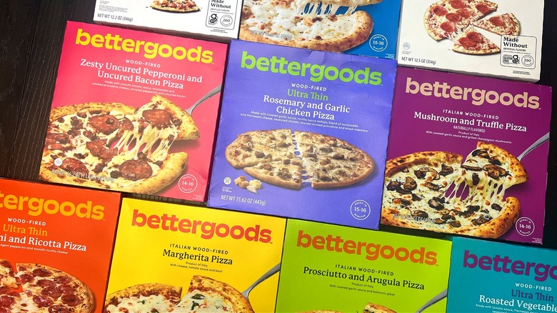 10 different Walmart Bettergoods frozen pizzas in boxes.