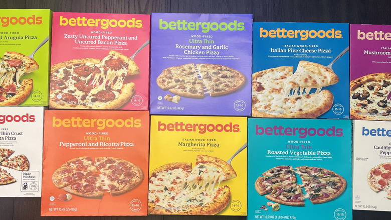 10 different Walmart Bettergoods frozen pizzas in boxes.