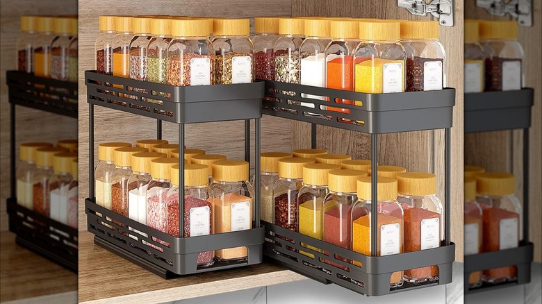 Aokiwo Pull-Out Spice Rack Organizer filled with assorted spices in a cabinet