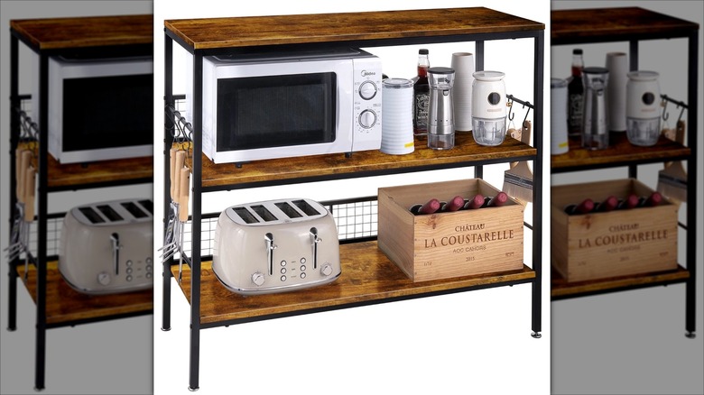 Behost Three-Tier Rolling Cart with a toaster, microwave, and box of wine