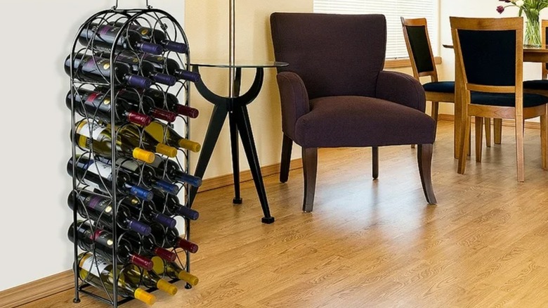 Sorbus Bordeaux Chateau Wine Rack against a wall with a chair and dining room table