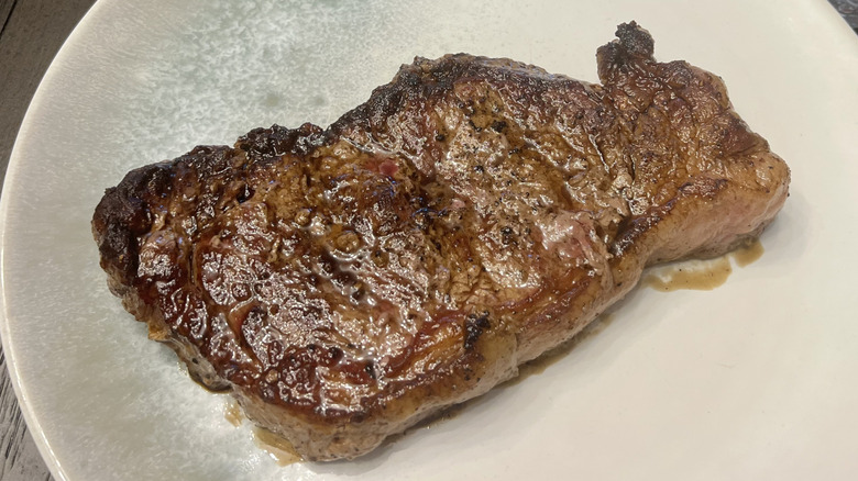 USDA Choice Angus beef New York strip steak on a plate