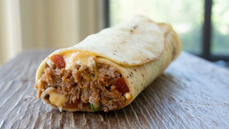 close up of a Tina's Red Hot Beef Burrito on table