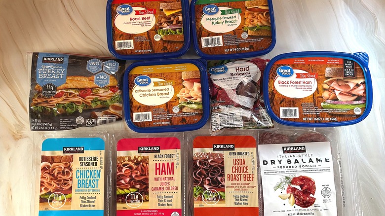 Packages of Kirkland and Great Value deli meat on table