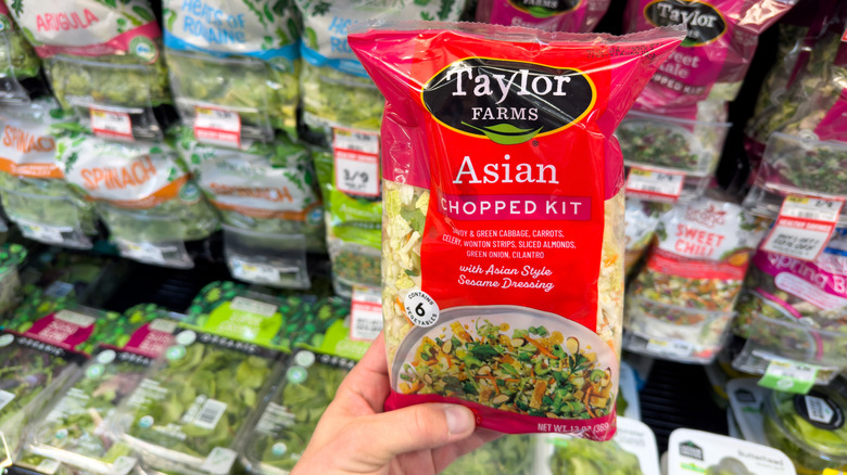 selection of bagged salads at grocery store