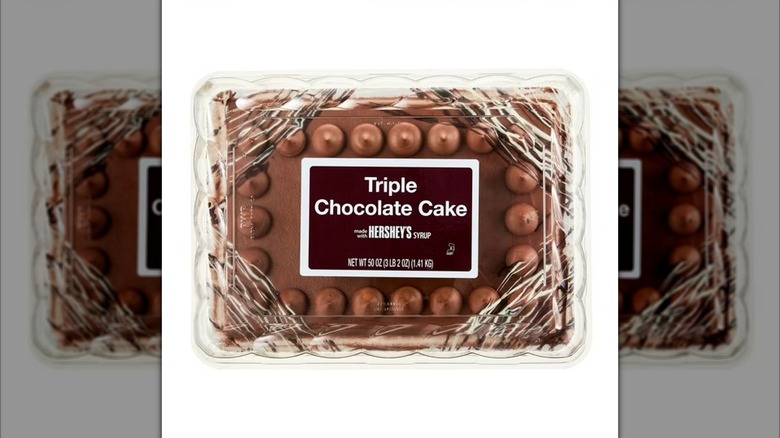 Package containing Freshness Guaranteed triple chocolate cake made with Hershey's icing