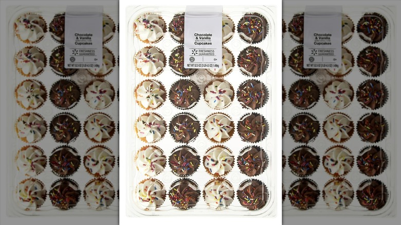 Freshness Guaranteed vanilla and chocolate cupcakes with white and chocolate icing and sprinkles