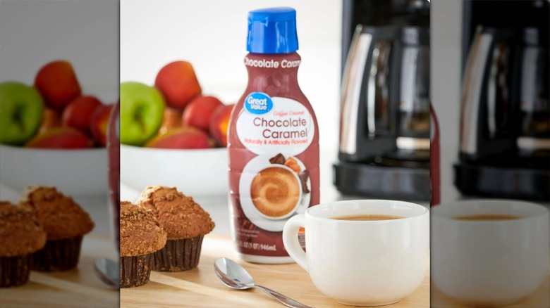 Walmart Great Value brand Chocolate Caramel coffee creamer beside a mug of coffee