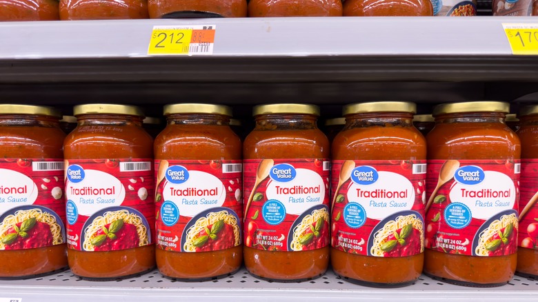 Jars of Great Value pasta sauce on shelf with price tags