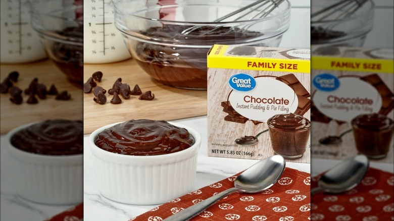 Great Value chocolate instant pudding and pie filling box with chocolate chips, milk, whisk, bowl, and spoon