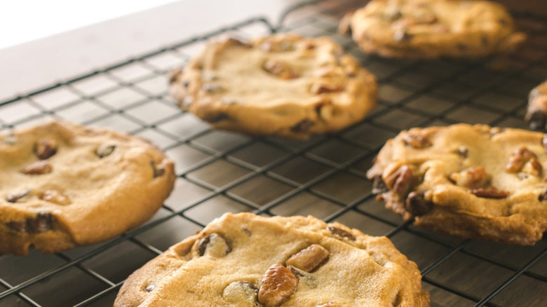 cookies with walnuts on a cooling rack