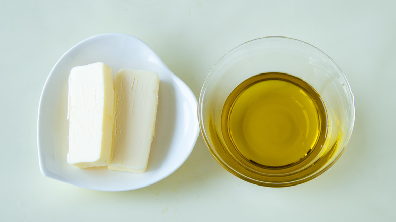 pats of butter and oil in a bowl