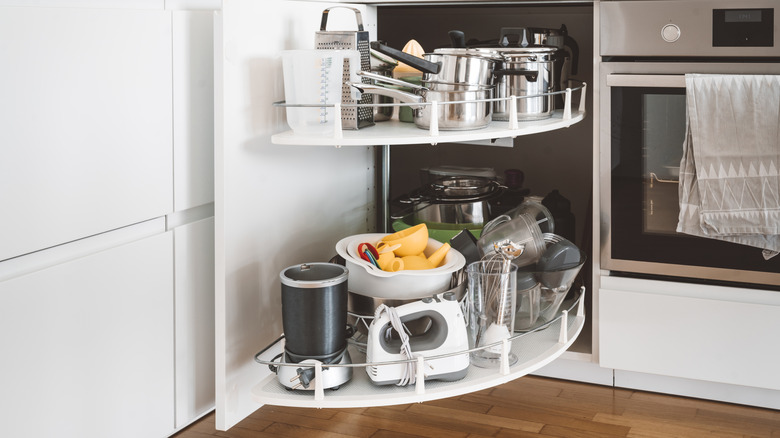 A corner cabinet with rotating shelving