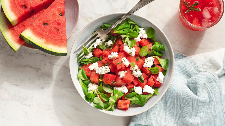Light summertime watermelon salad in a white bowl