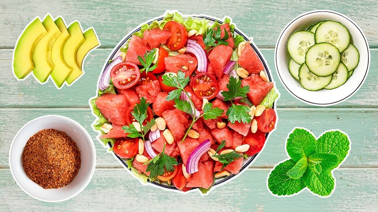 Watermelon salad with greens and cheese in white bowl
