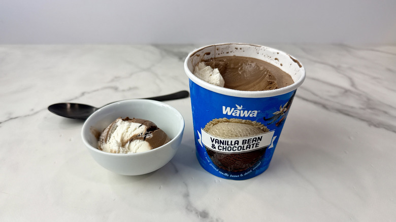 Wawa vanilla bean & chocolate ice cream carton and scoop in a bowl with a spoon