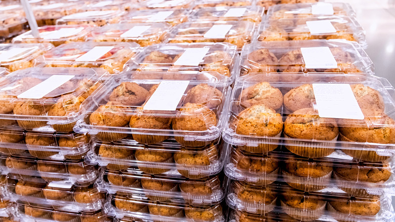 Supermarket display of muffins in plastic clamshell-style packaging