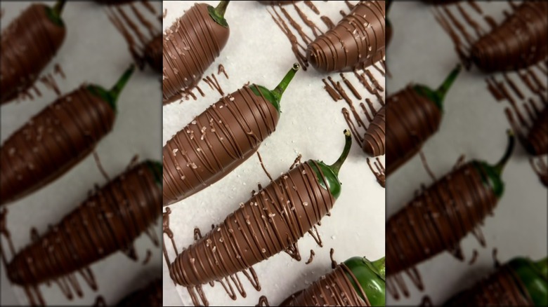 Chocolate-covered jalapeños on parchment paper