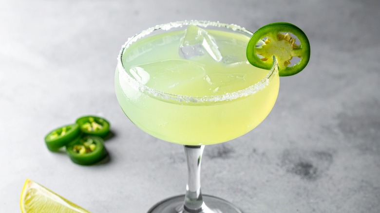 Spicy jalapeño margarita in a coupe glass