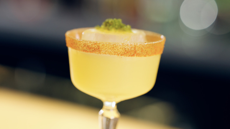 Cocktail in a glass with a spicy salt rim