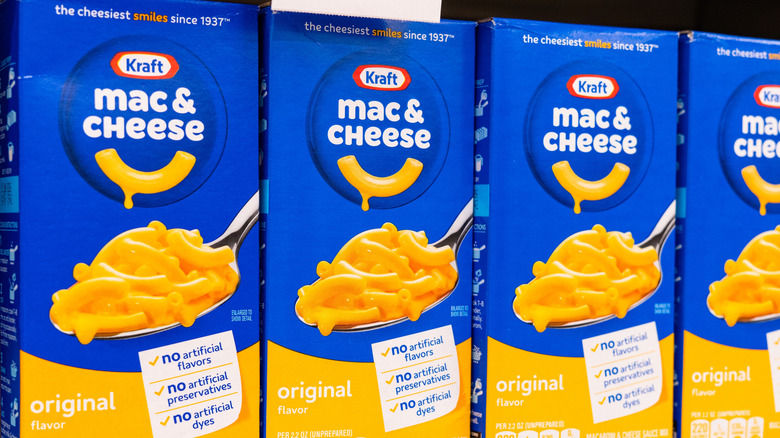 Boxes of Kraft Mac & Cheese on a grocery store shelf