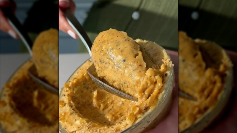 Spooning compound butter from a bowl