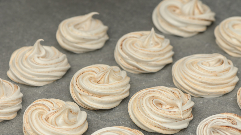 Some pastry puffs in a swirl on a sheet of tray