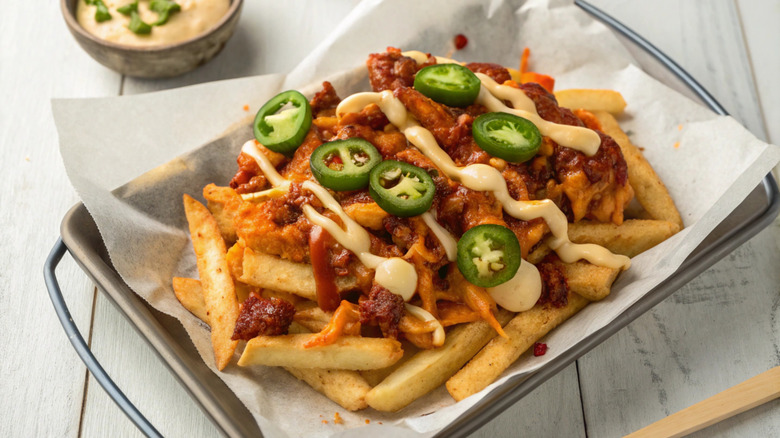 A pan of loaded French fries.