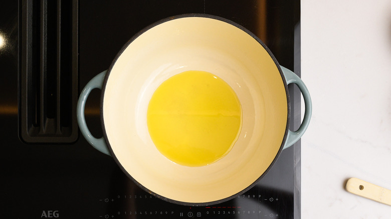 Large pan with olive oil on stovetop