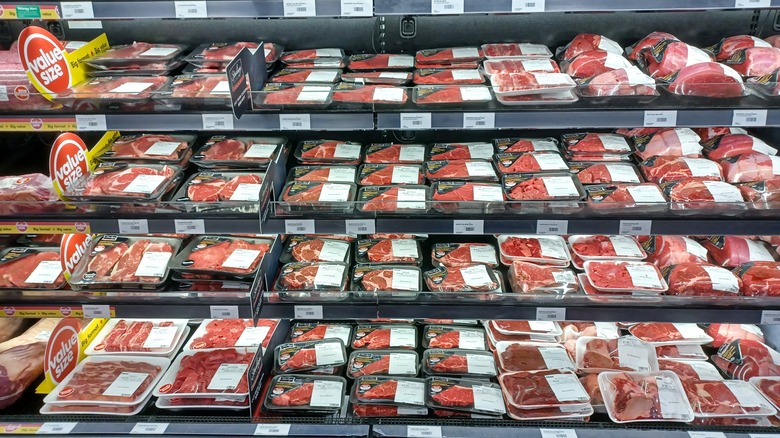 Large section of meat department at grocery store.