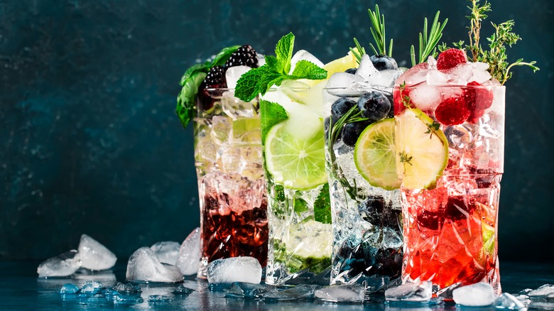 Brightly colored mocktails on background