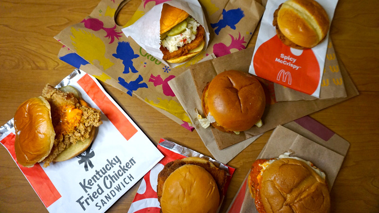 six chicken sandwiches with packaging