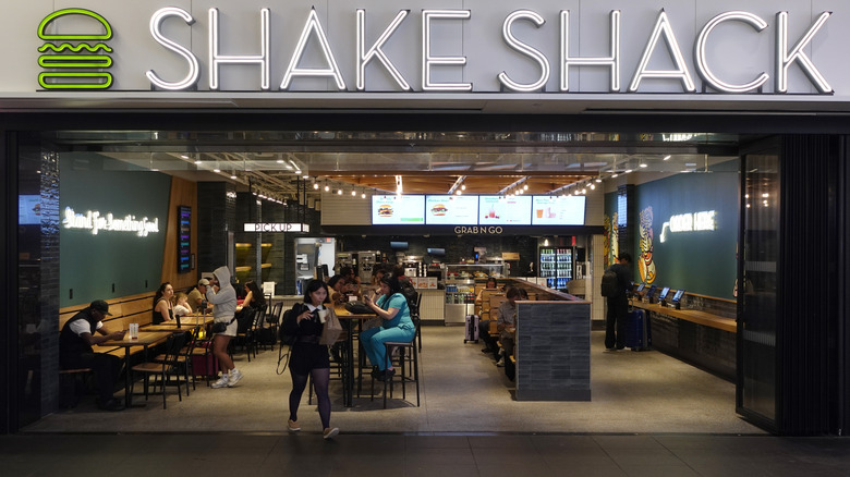 The inside of a Shake Shack seen from outside it