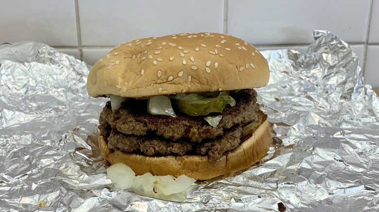 Five Guys sandwich on foil with Briny Bite topping