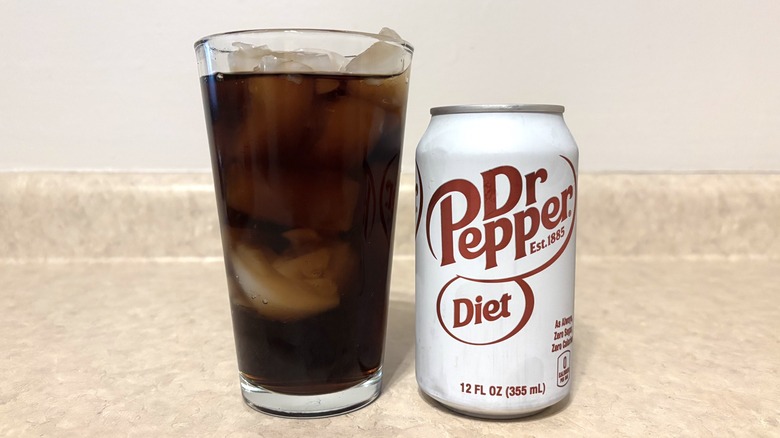Diet Dr Pepper in can and glass on neutral background.