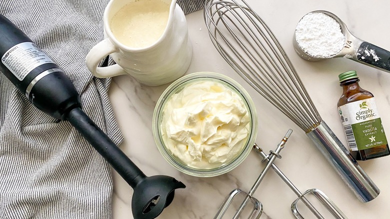 whipped cream and mixing utensils