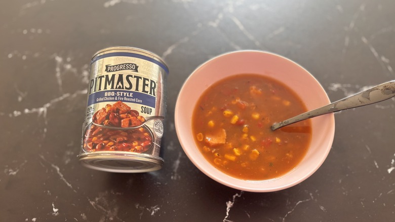 Progresso pitmaster soup can next to bowl of soup