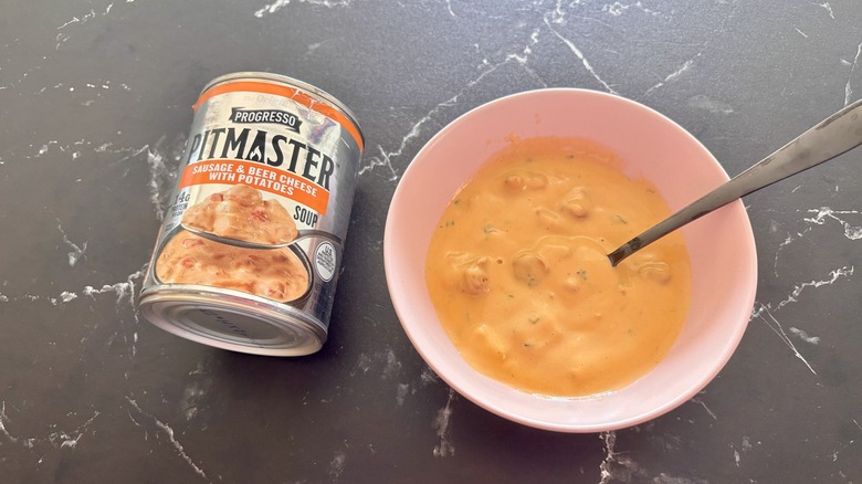 Progresso pitmaster soup can next to bowl of soup