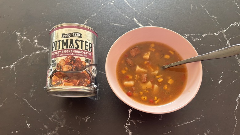 Progresso pitmaster soup can next to bowl of soup