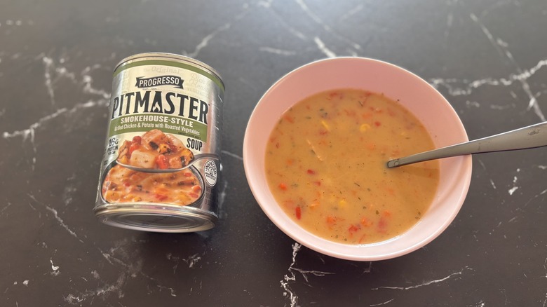 Progresso pitmaster soup can next to bowl of soup