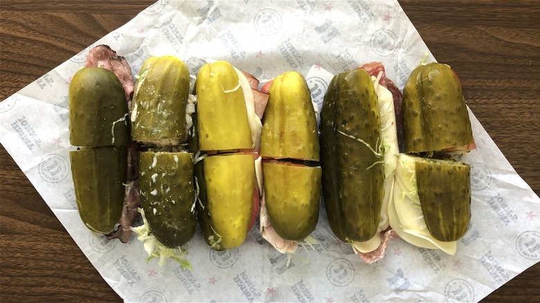 Six Jimmy John's Picklewiches laid out side by side.