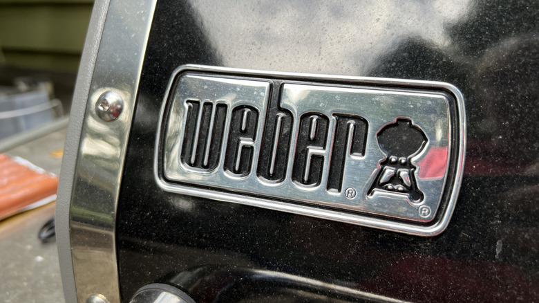 Close-up of the Weber logo on a grill