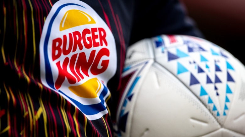 Burger King logo on shirt with football
