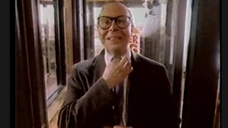 Burger King's Herb straightening his tie on commercial still