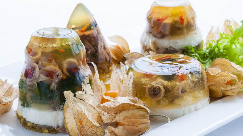 a plate of three bizarre-looking jell-o salads