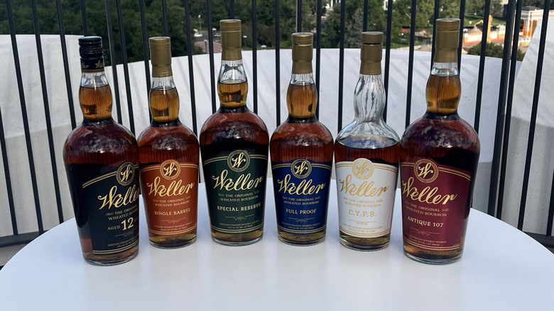 Six Weller bourbon bottles on table