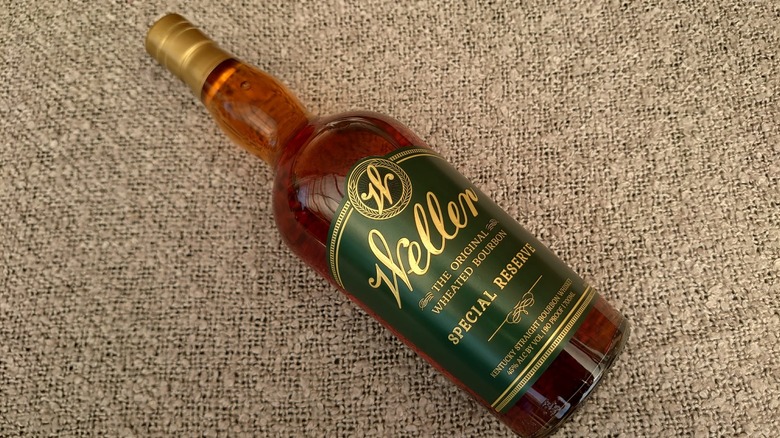 A bottle of Weller Special Reserve laid down diagonally on a grey blanket